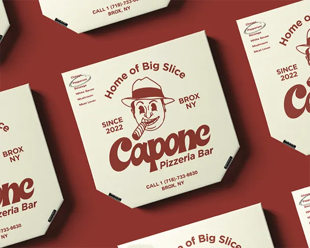 Pizza boxes display the text: "Home of Big Slice, SINCE 2022, Capone Pizzeria Bar, CALL 1 (718)-733-6630, BROX NY." Illustration of a man with a hat and cigar is centrally featured.